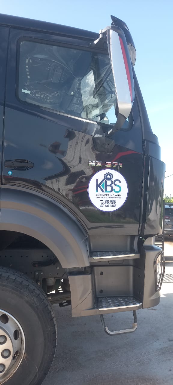 Close view of the KBS branding on the HOWO Sinotruk cab